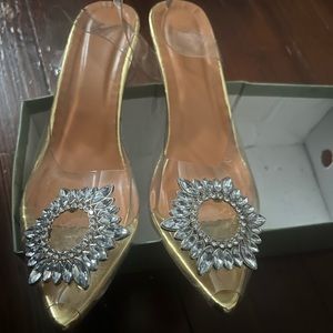 Shoes clear with jewelry on it